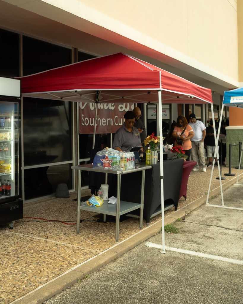Annie B's outdoor ordering station with red tent canopy